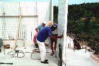 [Rod inserting a panel over pipes]